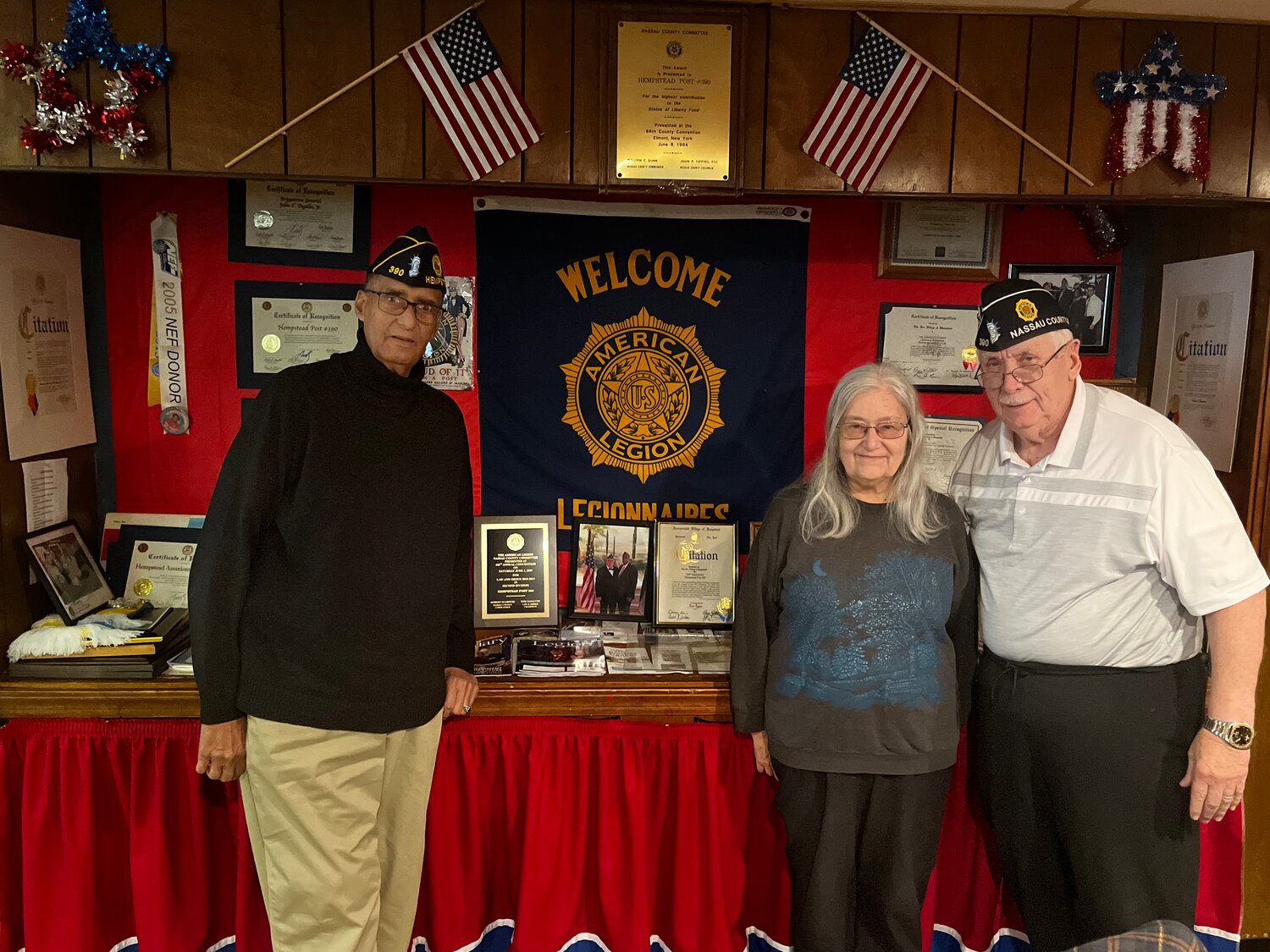 Board members of the American Legion Post 390, the largest veterans' organization in the country, dedicated to advocating for and supporting veterans, service members, and their communities by offering them much-needed resources like access to counseling, free and low-cost healthcare services, access to food pantries and more — located in the Village of Hempstead. From left: Harry Ransom, Mary Burns, Frank Neal