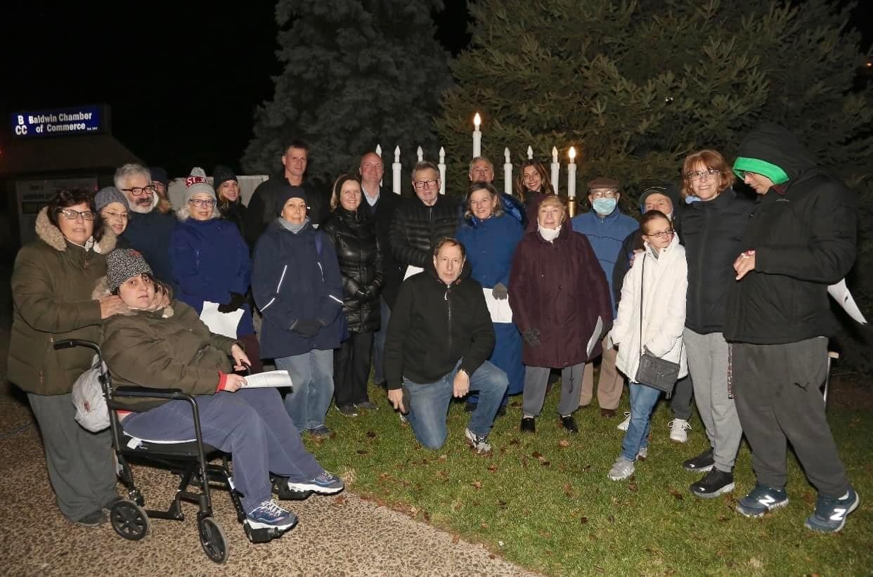 Dozens of community members at last year’s candle lighting.