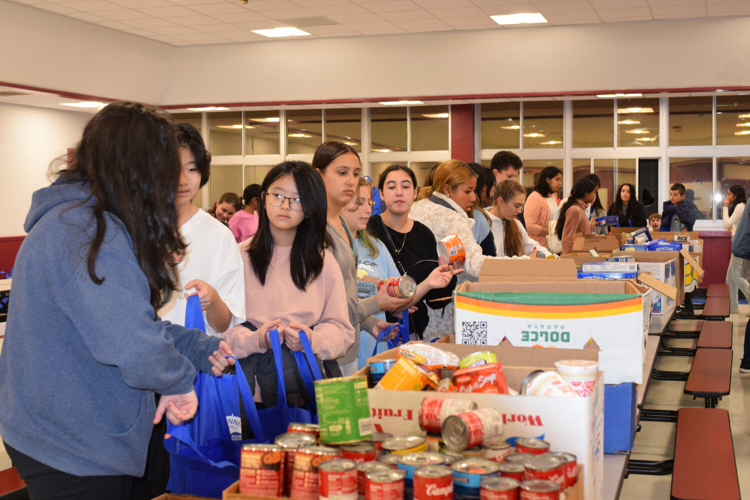 The Kiwanis Club of East Meadow ran a successful food drive, which all came together during a tremendous weekend of giving back to those in need. Volunteers from the club and W.T. Clarke’s High School’s Key Club helped assemble 165 baskets of food.