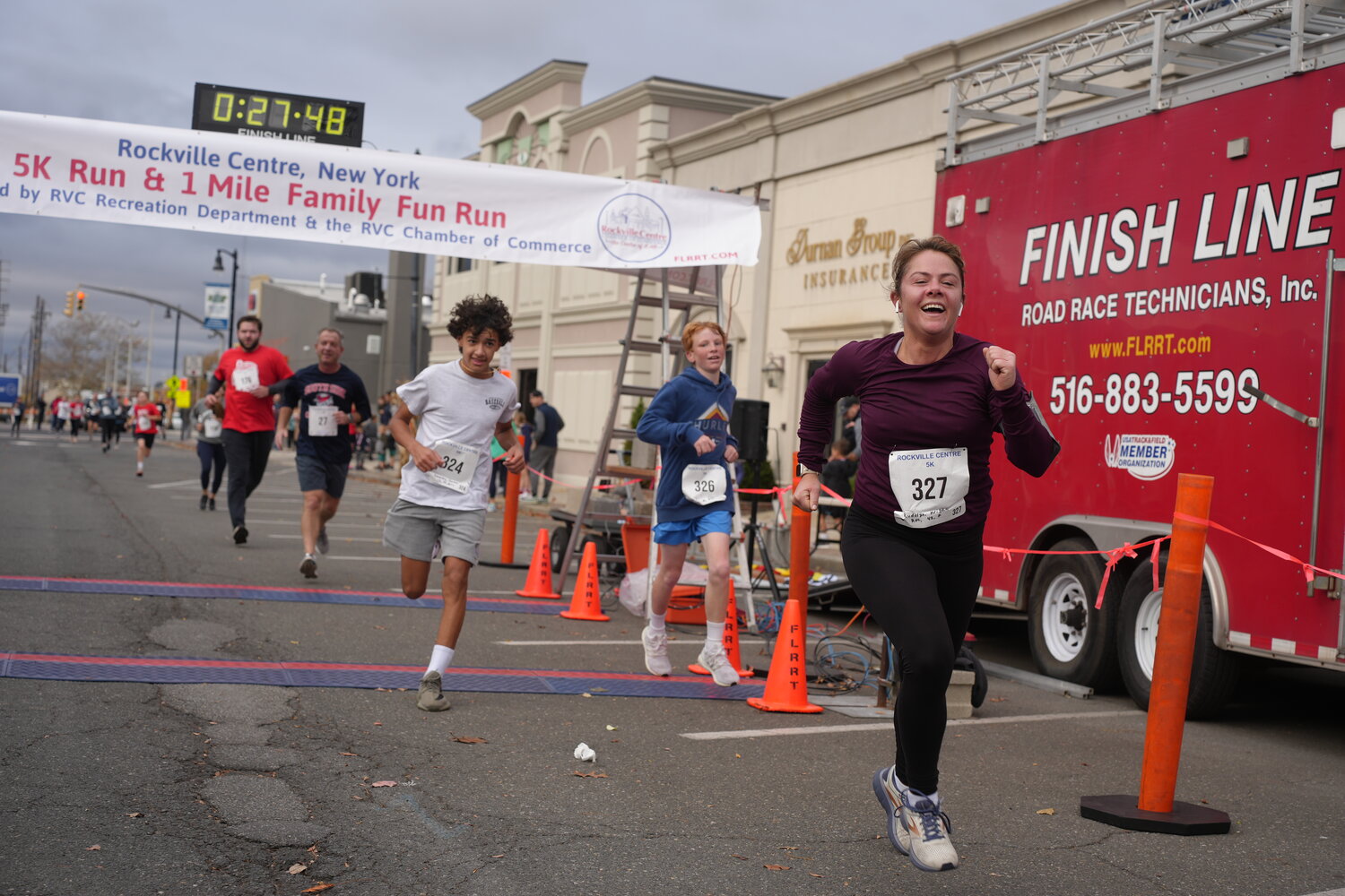 Kristin Rudolph, 42, of Rockville Centre breezes through the finish line with a time of 27 minutes, 46 seconds.