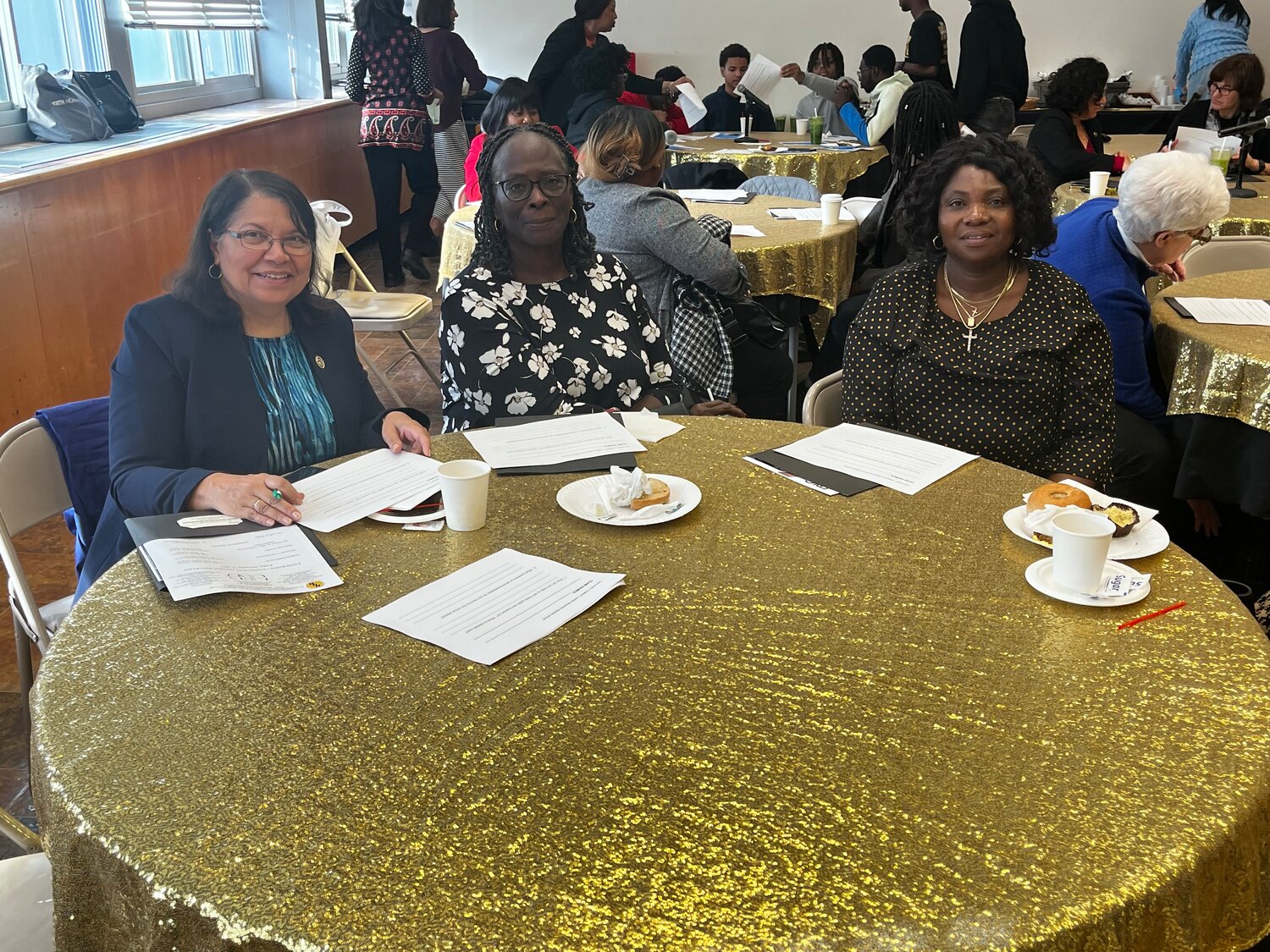 A table full of community leaders recognized by the Uniondale school district for all of their work within the neighborhood. From left: Jeannine Maynard, activist and co-facilitator for the Greater Uniondale Area Action Coalition, library trustee Deborah Mabry, and Pastor Lucie Tshama of Uniondale United Methodist Church.