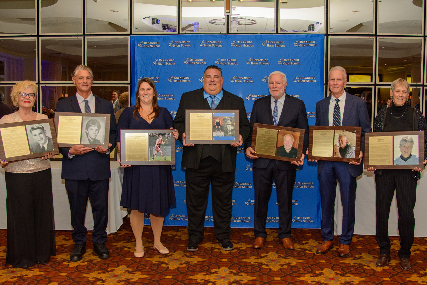 At the Oceanside Circle of Pride induction ceremony last week, Dianne Lloyd, a member of A. Hugh Jack’s family, far left, joined the other inductees, Christopher Paggi, Caitlyn Collins Siniscalchi, Mike Delibero, Jim Volpe, Gary Statham and Lynn Miller.