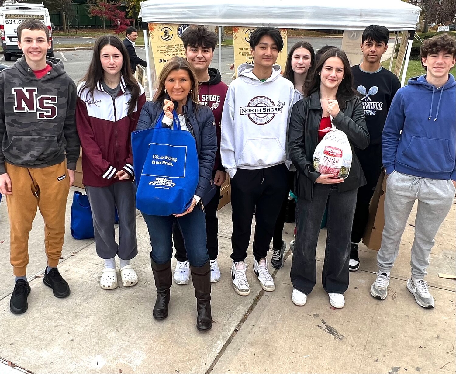 Students from the North Shore High School Key Club helped the chamber hand out turkeys to the North Shore community.