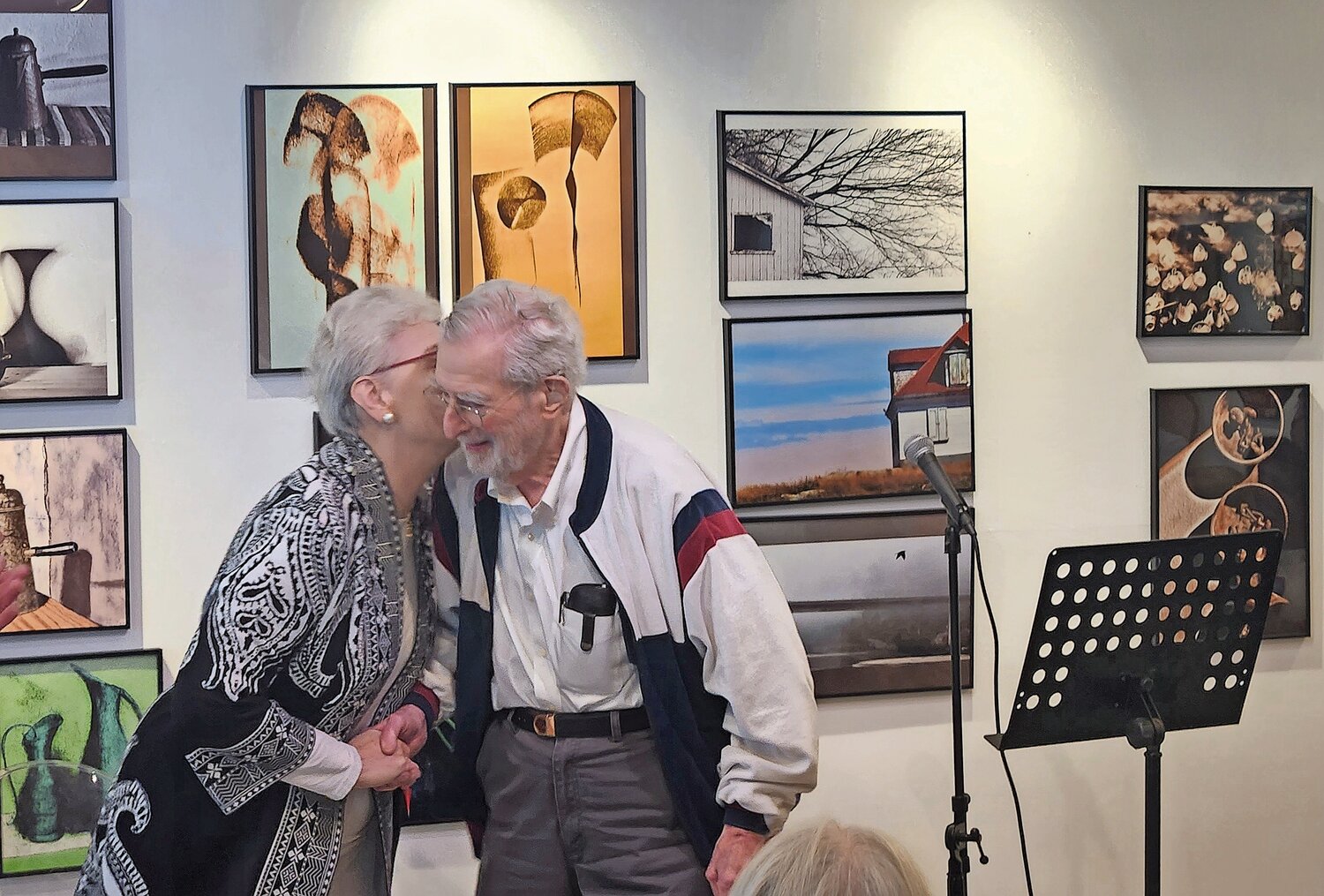 Victoria Bjorklund, left, and George Strausman, two of the 13 poets who took Evelyn Kandel’s long-standing poetry class, congratulate each other after reading their respective poems at the Sea Cliff Arts Council.