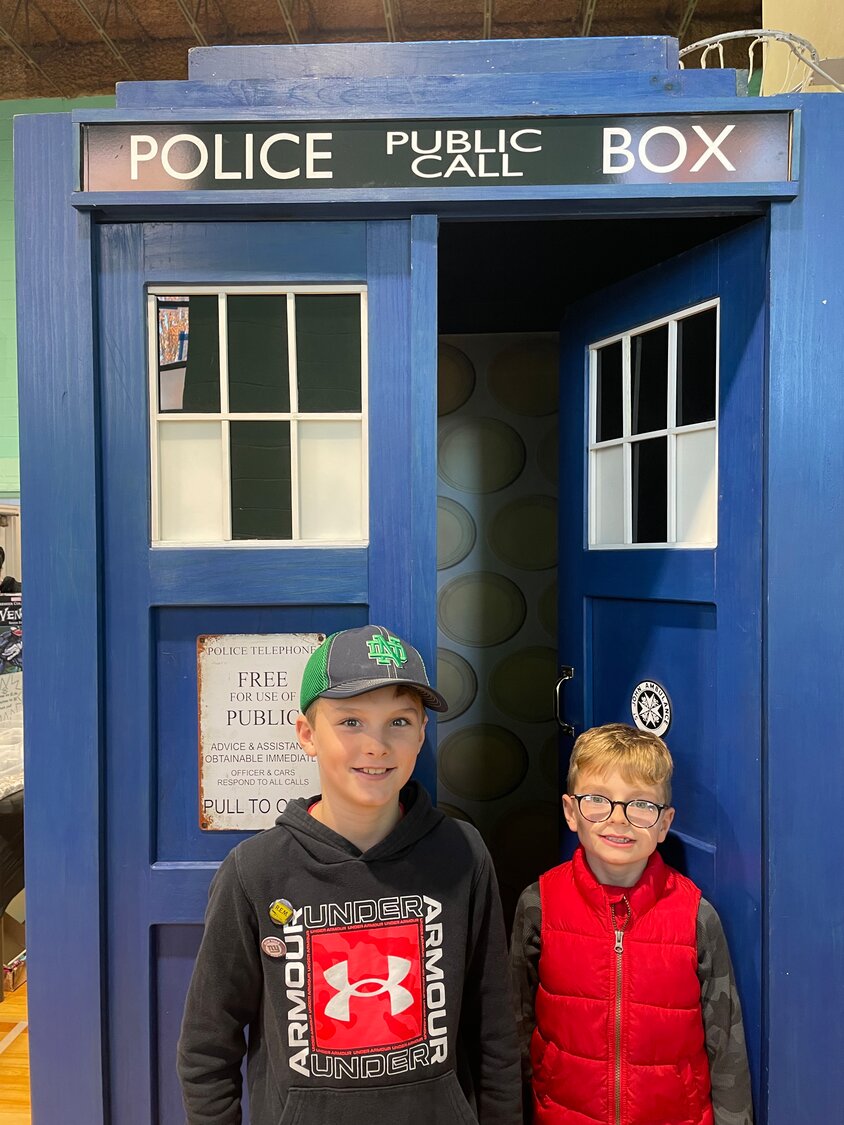 Jake McNichols, left, and Rory Falbee enjoying the life-sized TARDIS replica at HurriCon, the benefit comic convention run by Bethany Congregational Church. Falbee’s favorite comic character is Harley Quinn, while McNichols is a Superman fan.