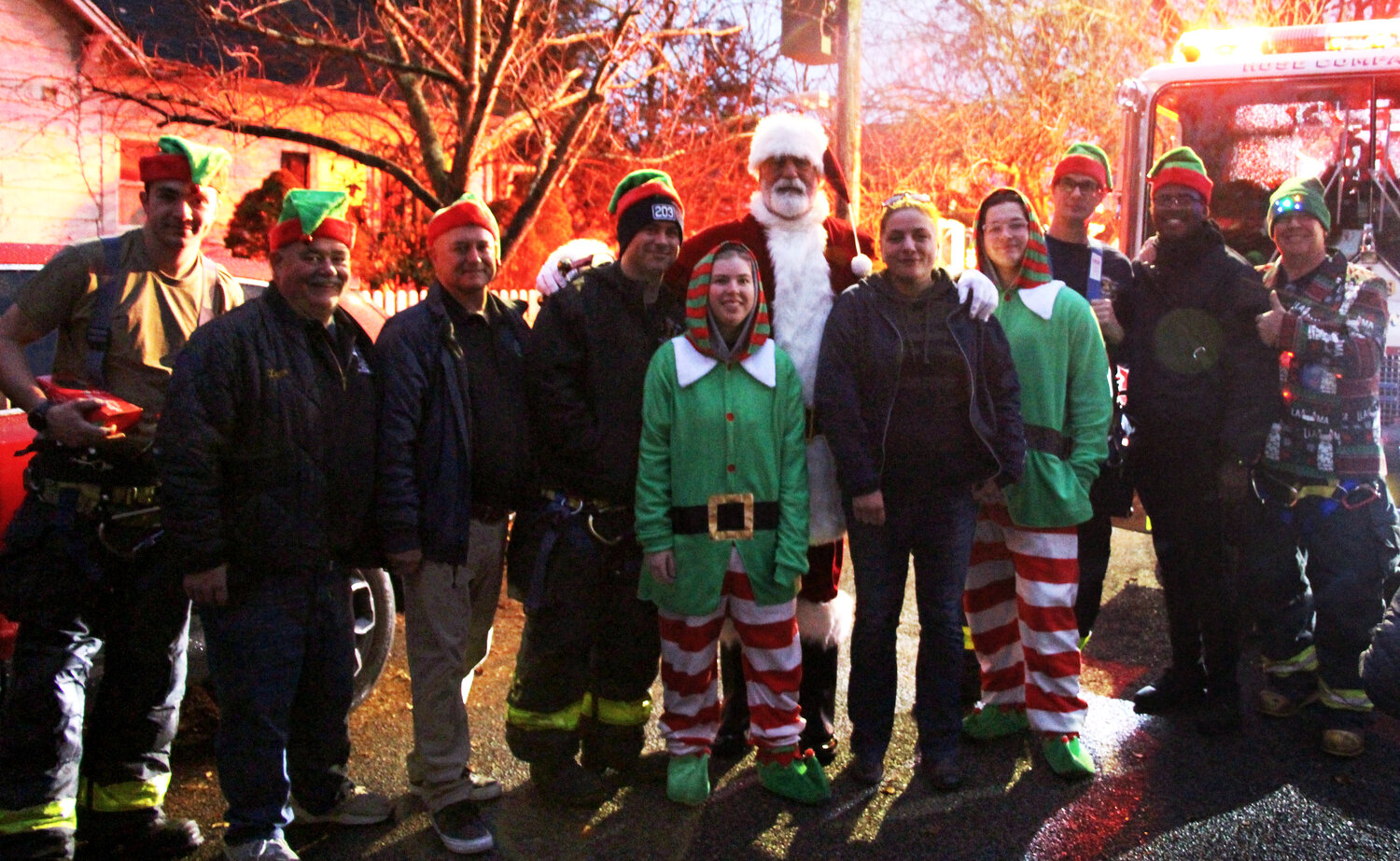 Santa with Liz Giles, in the center, and the Baldwin Fire Department Company Hose 3.