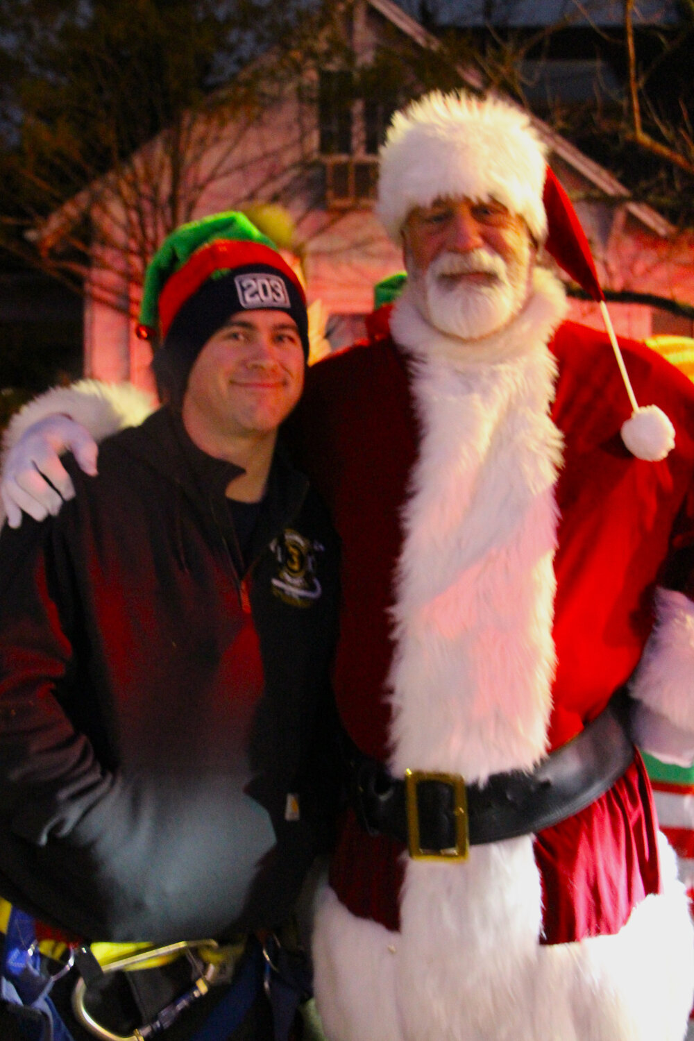 Joseph Eberhart, Baldwin fireman and one of Santa’s helpers, with Santa