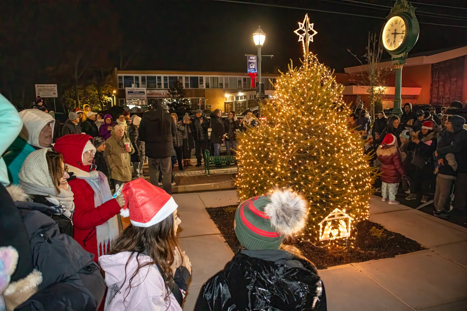 Pine Oaks Landscape Design and Maintenance donated the tree, which has been permanently planted at the Lidl shopping center in Franklin Square that was lit up for the holidays on Nov. 25.