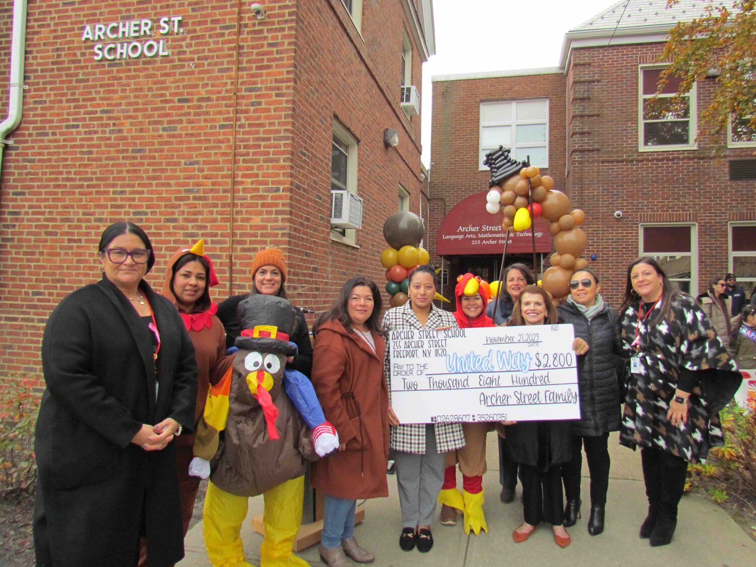 United Way of Long Island Community Impact Director Biena Depenaaccepted a donation from Archer Street School Principal Paula Lein joined by Board of Education President Maria Jordan-Awalom, Board trustee Sonia A. Dixon, Assistant Superintendent for Educational and Administrative Services Dr. Helen Kanellooulos, Assistant Superintendent for Curriculum and Instruction Glori Engel and staff.