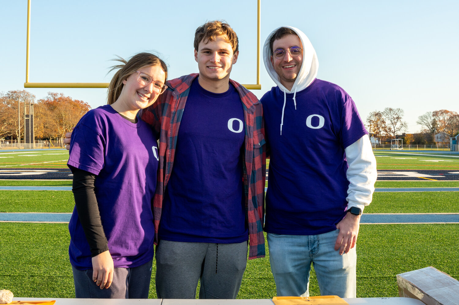 Sam Farsky, Justin Connolly and teacher Vincent Simonetti, the adviser of the National Science Honor Society, took their laps around the high school track.