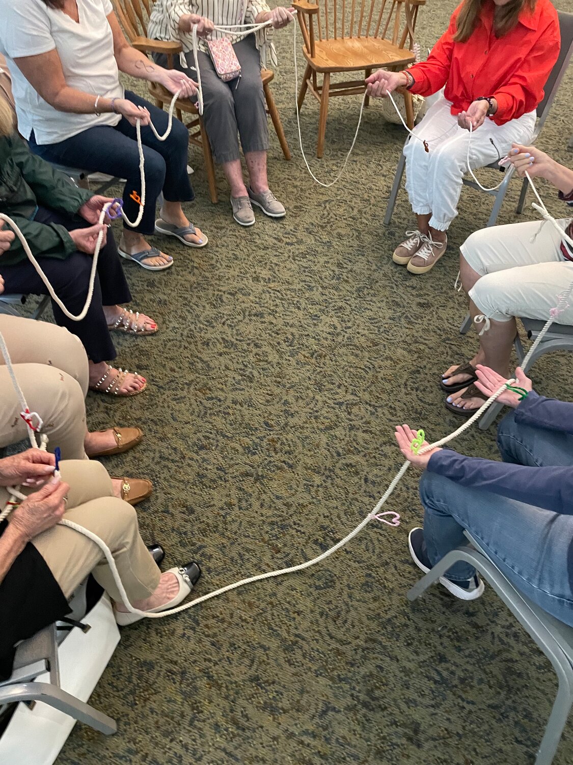 The group holds a rope each meeting to signify their connection.