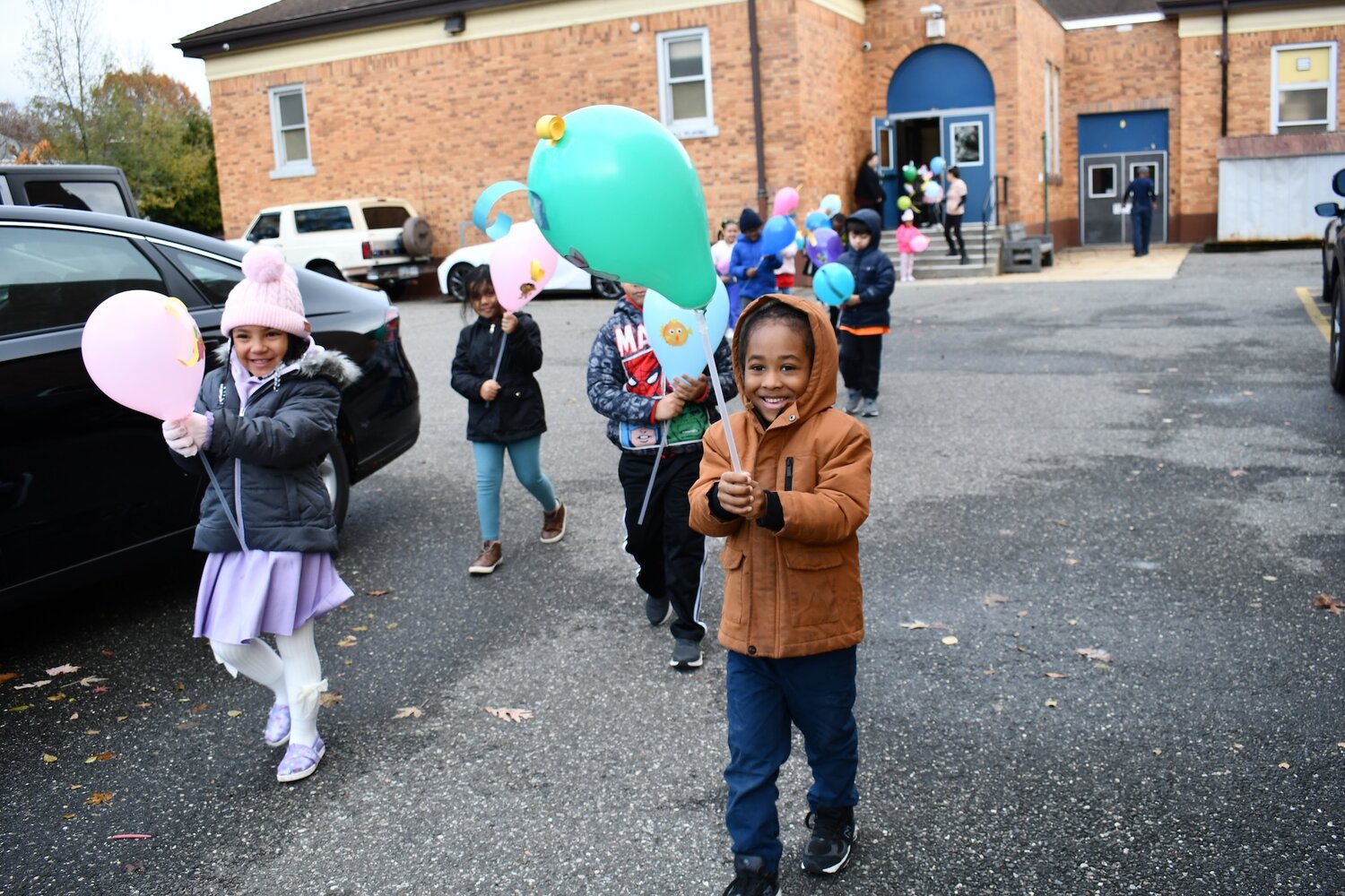 The kindergarten balloon parade is a Thanksgiving tradition for Maurice W. Downing Primary School students.
