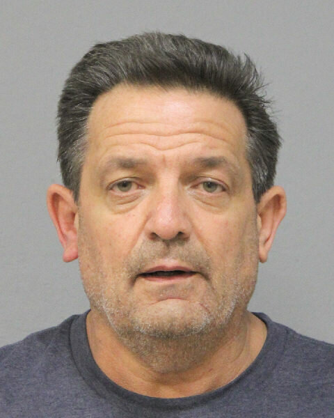 Nassau County Police Department's arson bomb squad arrested John Courtien, 57, of Freeport in connection to a car fire that took place in Rockville Centre early Tuesday.