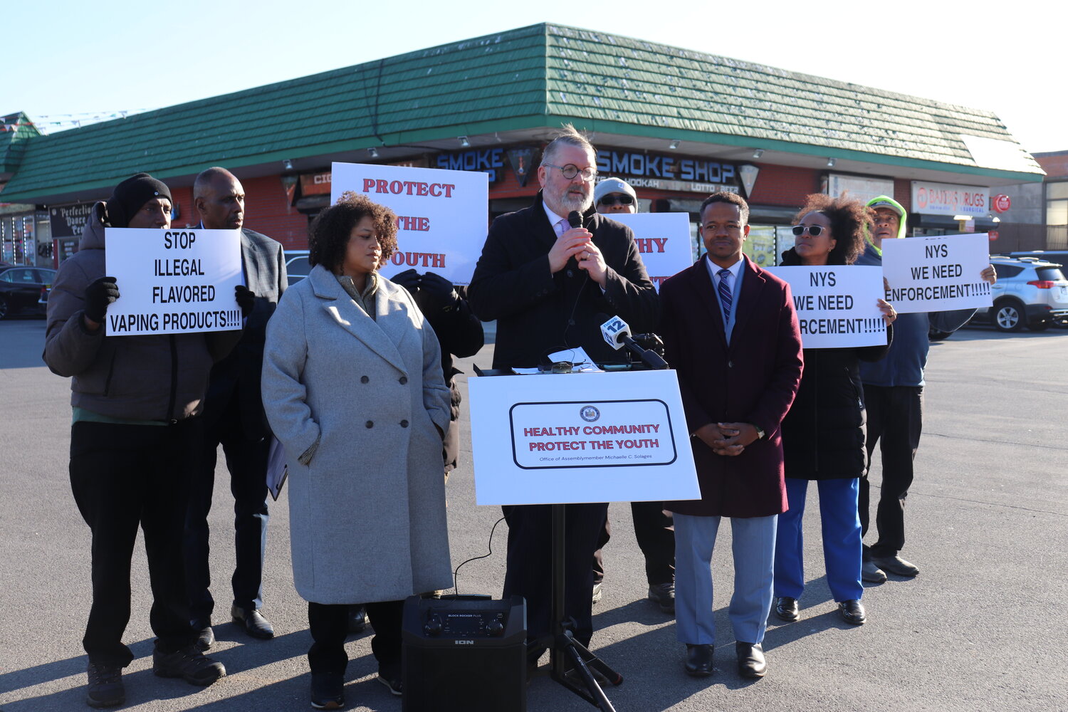 New York Association of Convenience Stores president Kent Sopris, Assemblywoman Michaelle Solages, County Legislator Carrié Solages and members of the Elmont community call on Gov. Kathy Hochul and the state legislature to crack down on flavored vape products.