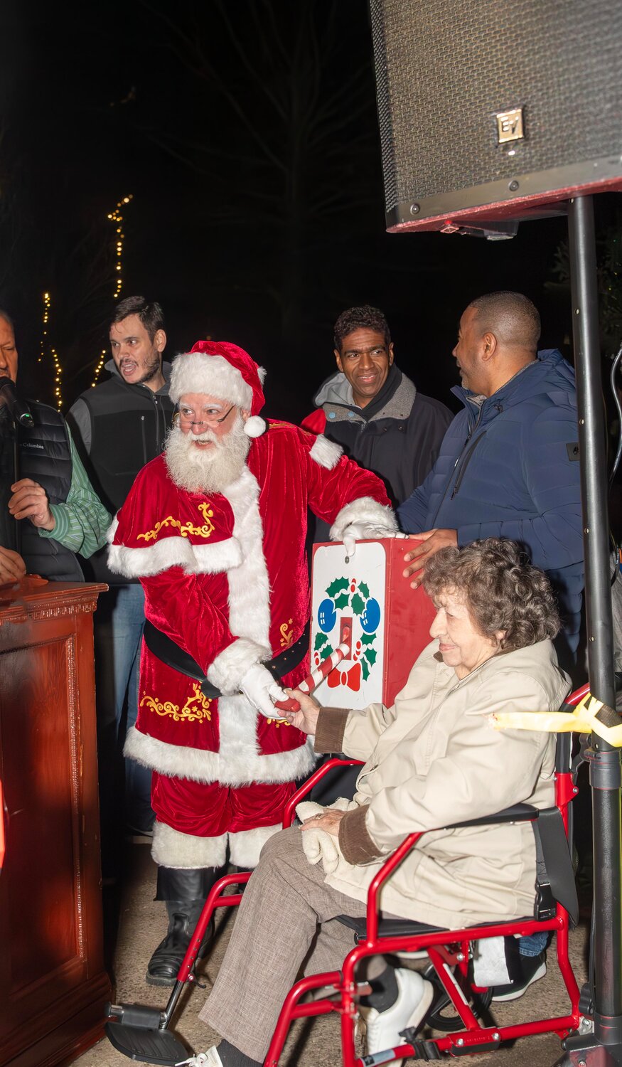 Santa Claus alongside 98-year-old resident Florence Gunther flipped the switch to light up the village’s Christmas tree at Arthur J. Hendrickson Park.