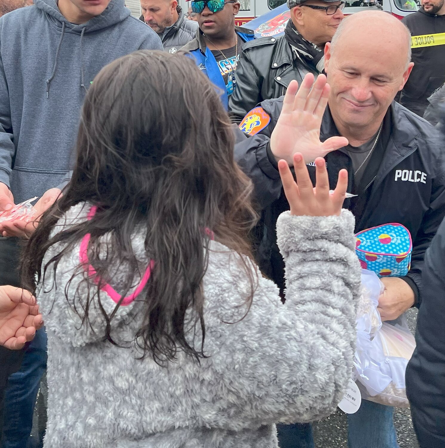 Nassau County Police Department commissioner Patrick Ryder joined the volunteers in passing out the free toys, slapping high-fives with the Uniondale youngsters who patiently waited to receive gifts.