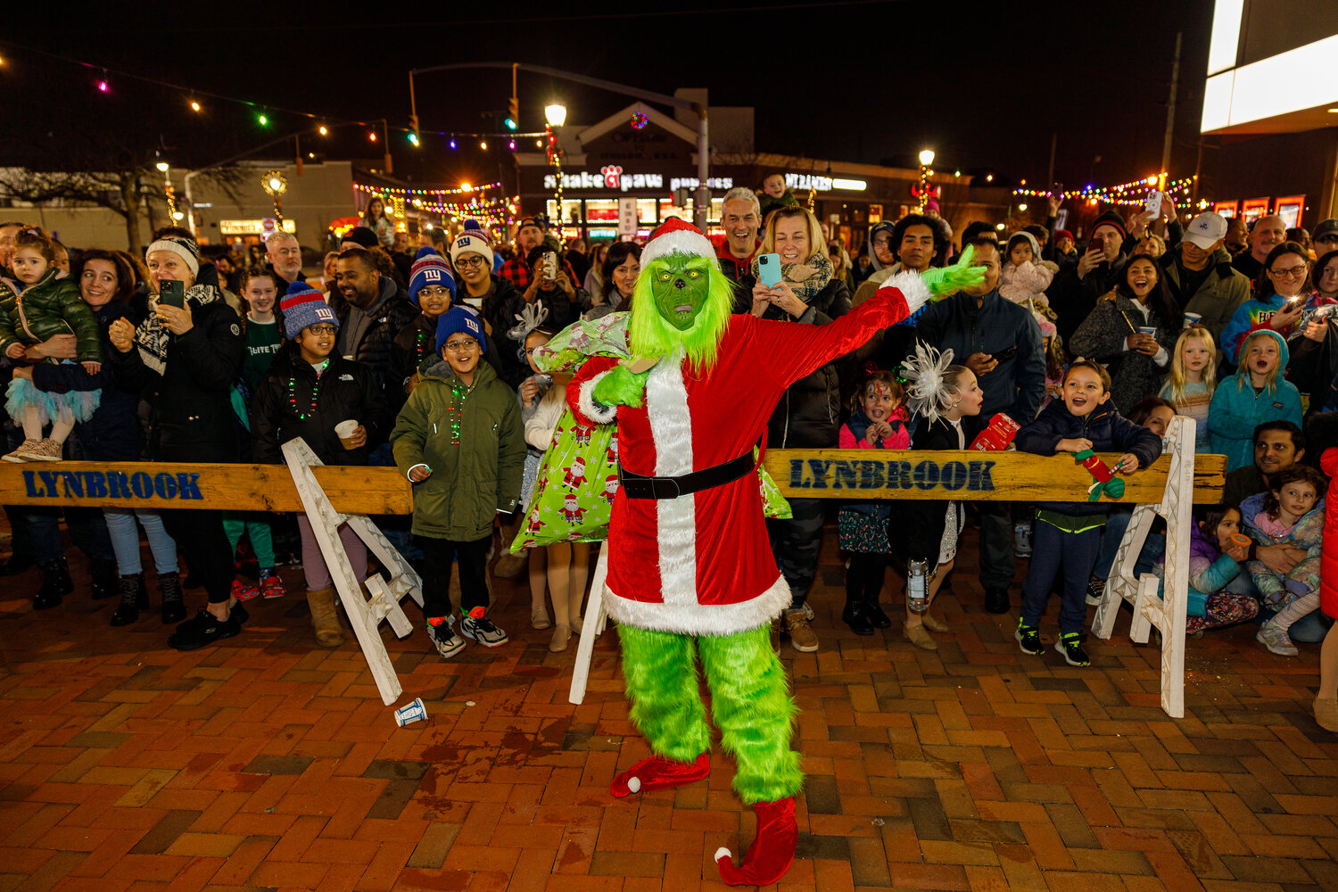Watch out! The Grinch made an appearance during Lynbrook village’s annual tree lighting ceremony — but perhaps being around so many smiling neighbors made his heart grow three sizes that day.
