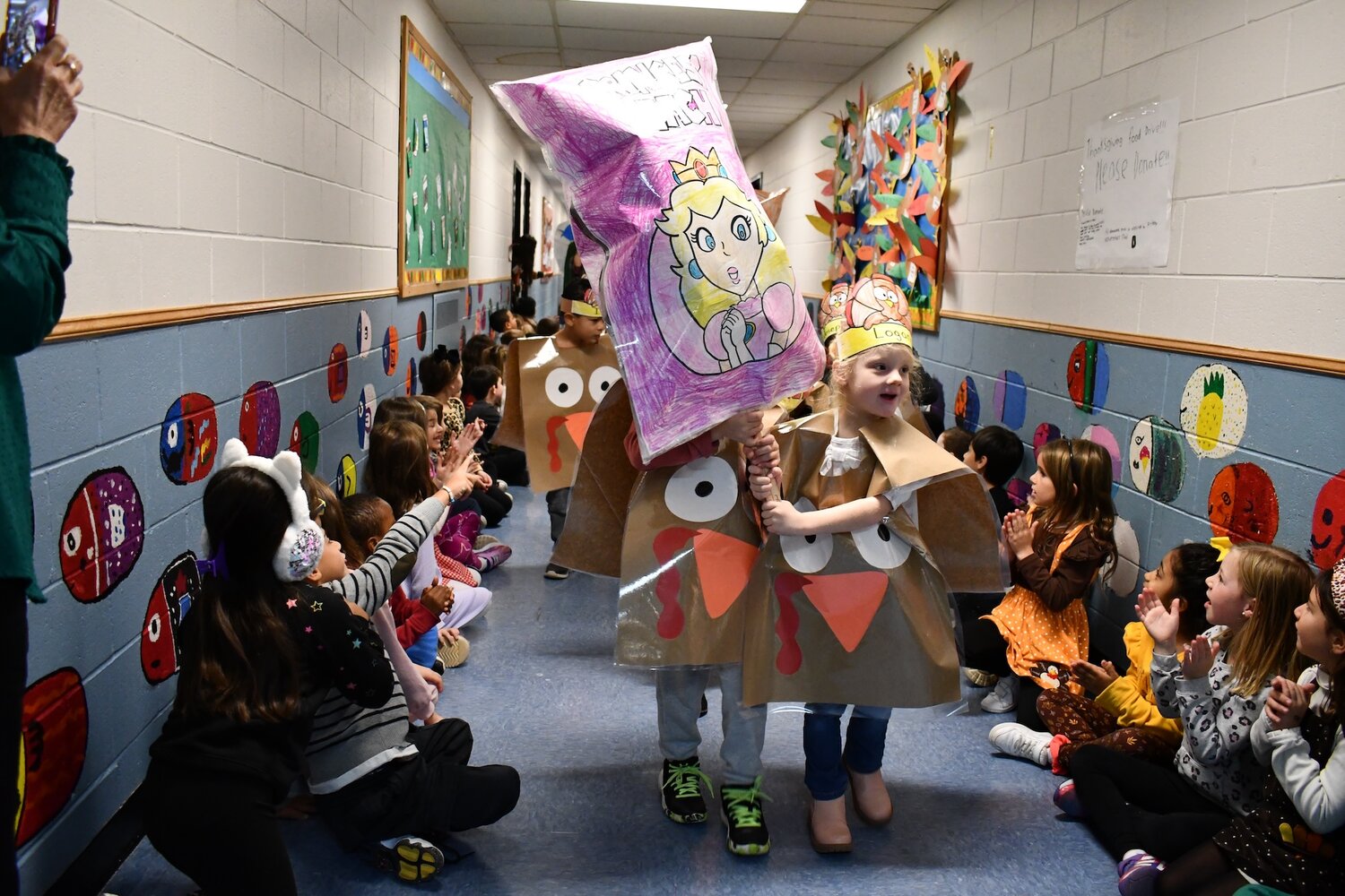 Kindergarteners waved posters of their favorite characters during their annual “Balloons Over Rhame” parade. Some crowd favorites included Princess Peach, Barbie, Yoda, and minions.