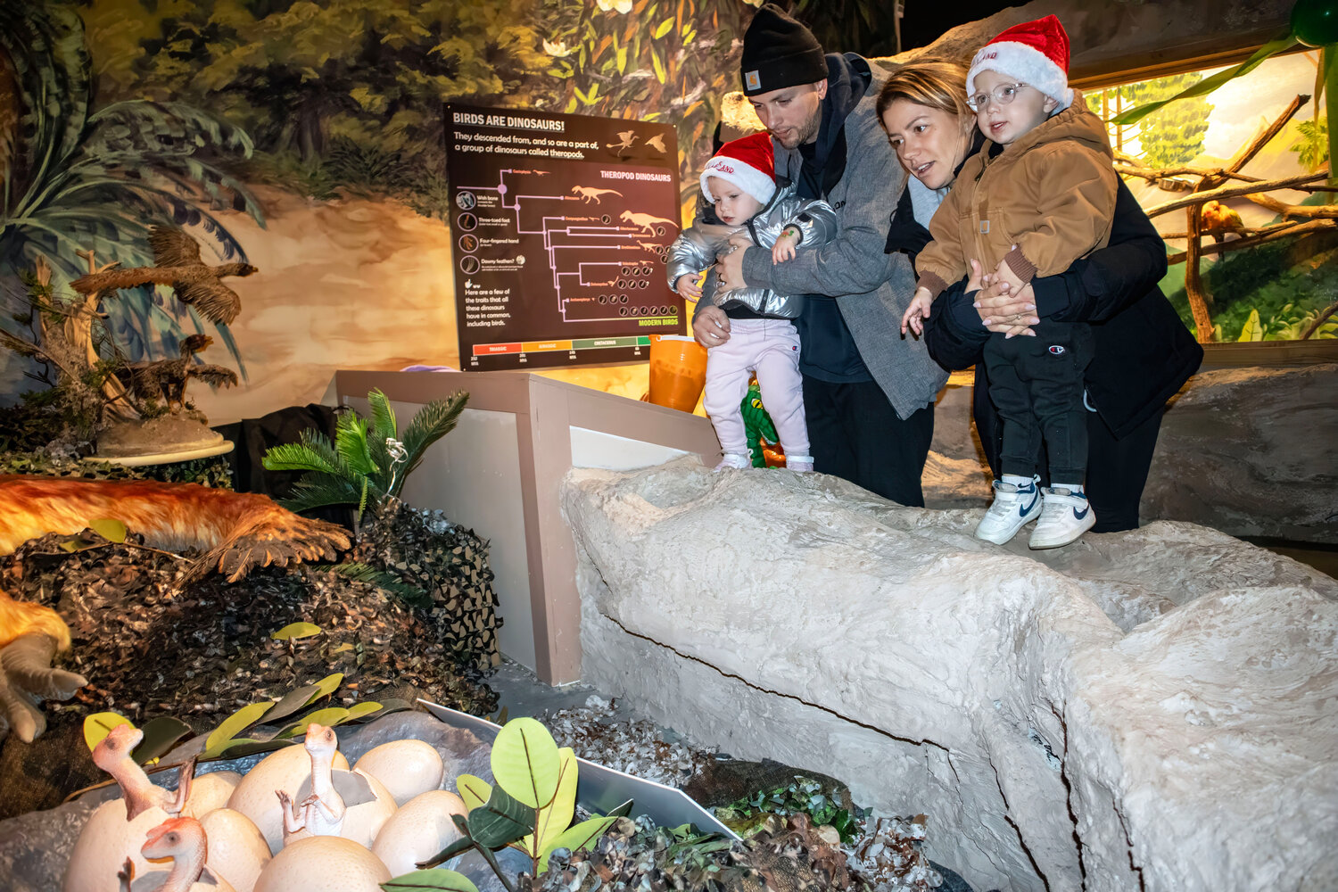 Checking out the baby dinosaurs as they are hatched are (L-R) Andreanna Aiosa (Age 2), Vincenzo Aiosa, Tanya Aiosa, Vincenzo Aiosa (Age 2).