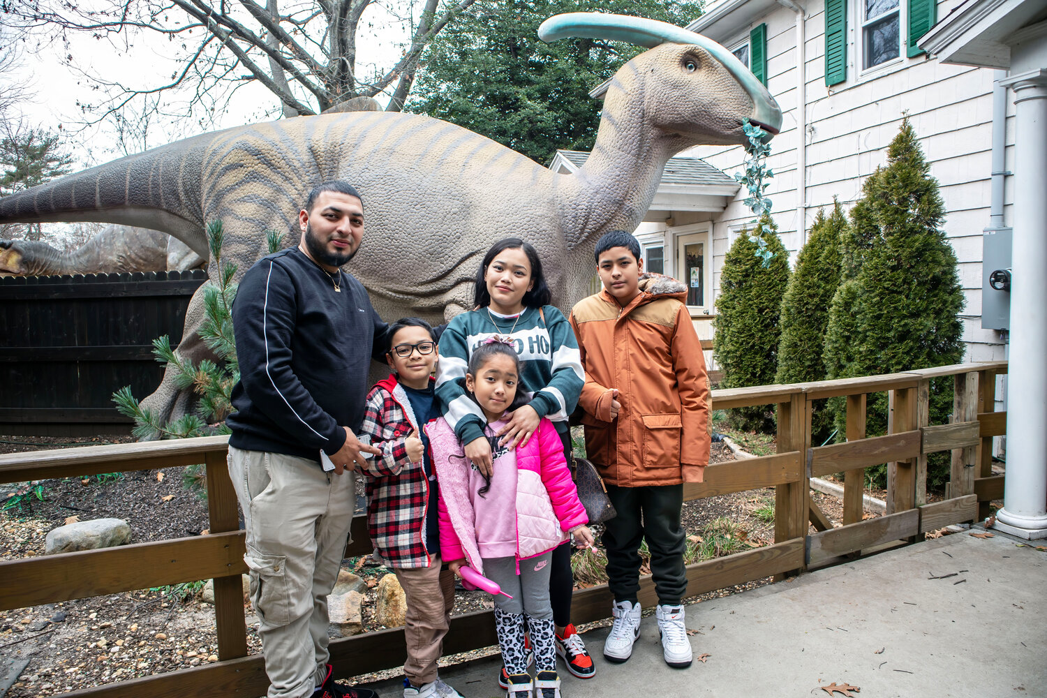 Posing with the Parasaurolophus are (L-R) Edwin Campos, Jordy Jovel (Age 8), Teresa Campos (Age 6), Hazel Jovel, Jostin Campos (Age 11).