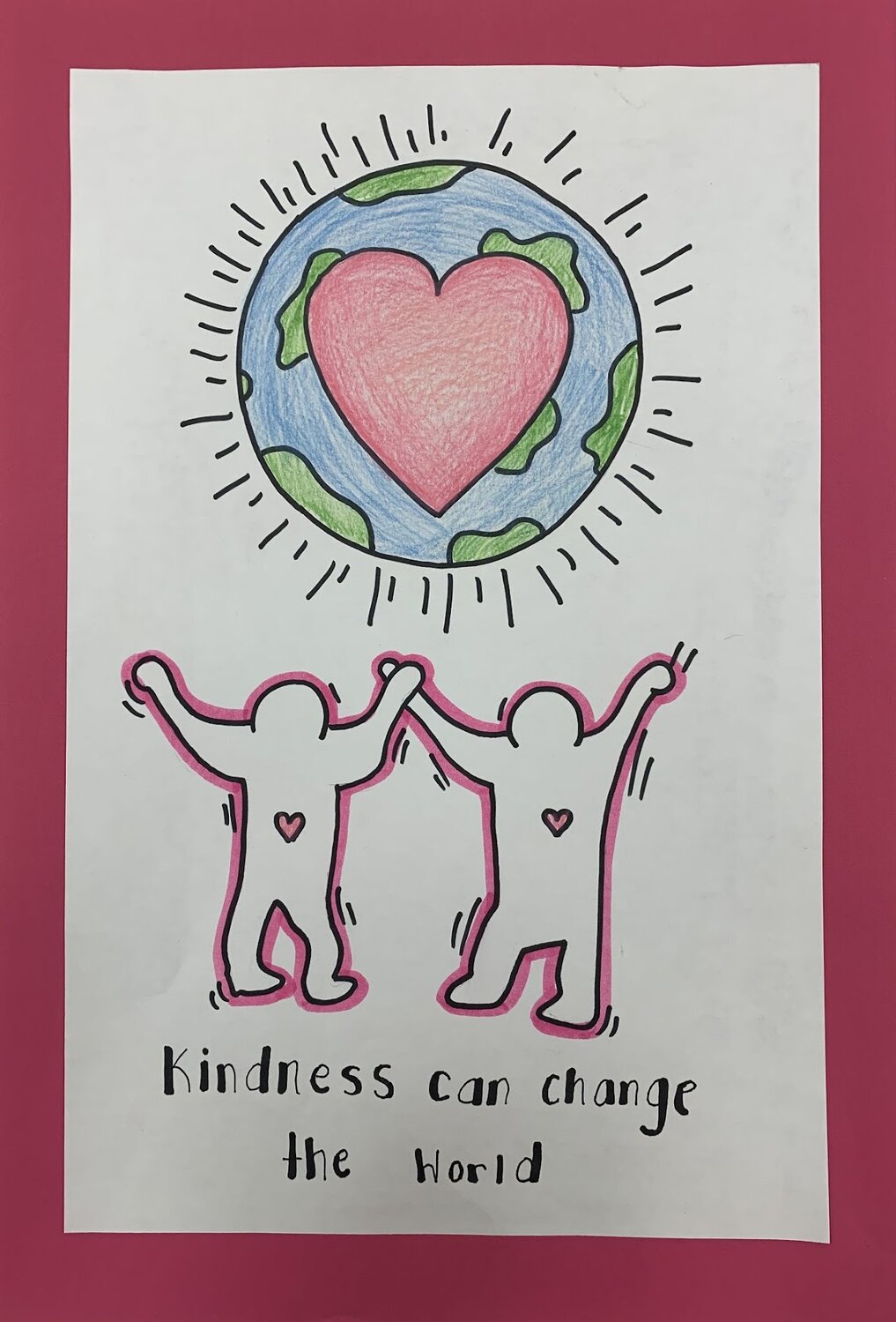 Eighth-grade art student Olivia Bragino creates her Keith Haring inspired drawing, entitled “Kindness can change the World.”