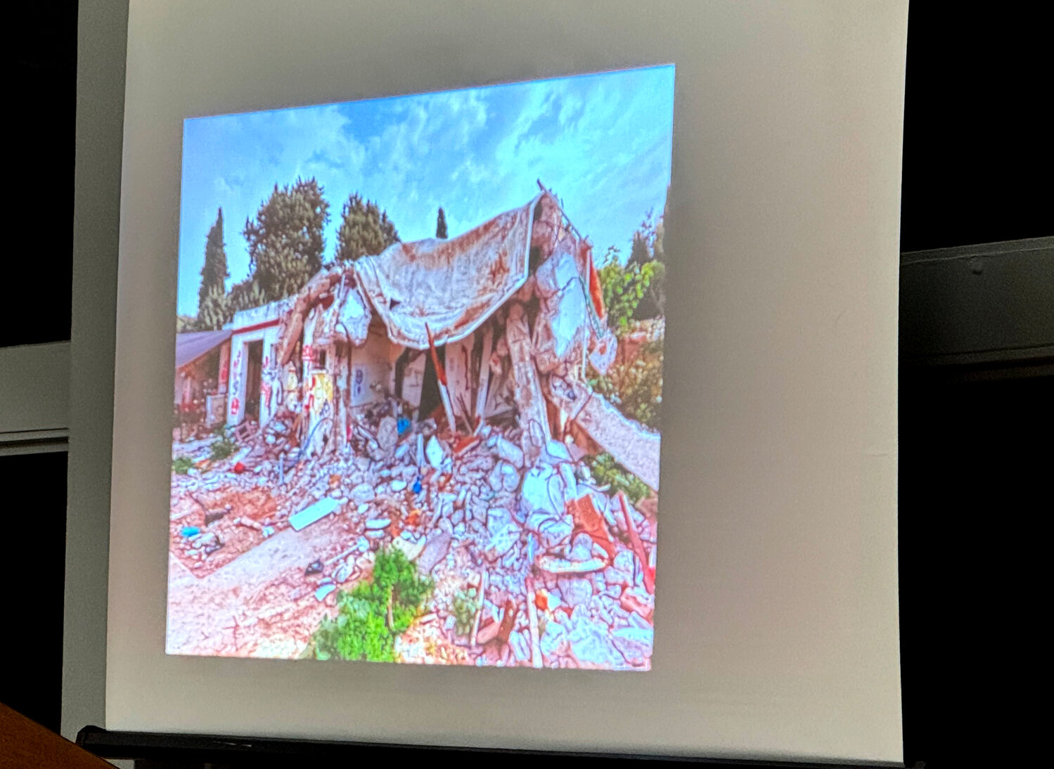 David Sussman showed images of homes burned to the ground — many that had people still inside them.