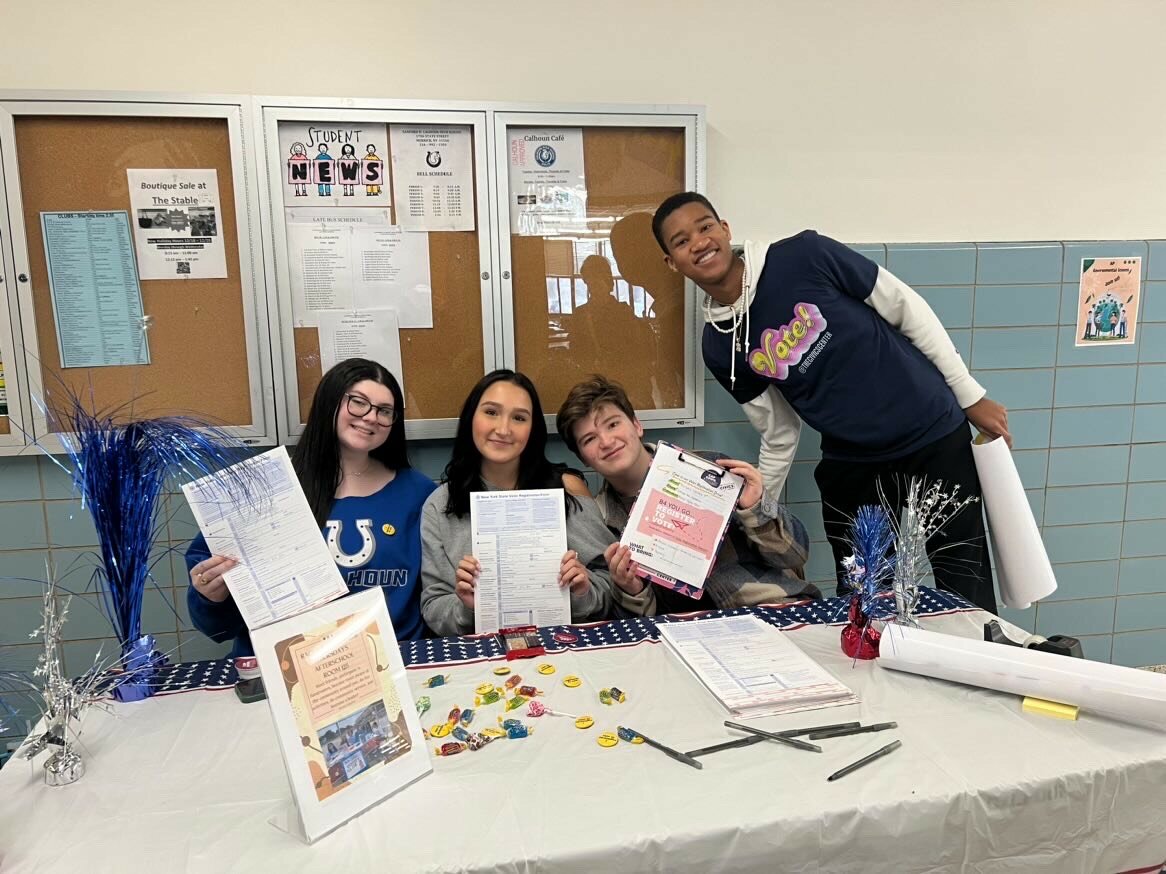 Members of the Racial Equity Club at Calhoun High School — from left, senior Jillian Grossberg, junior Mia Marchlowska, junior Jack Messinger and senior Nickolas Mascary — ran a voter registration drive last week, as part of the district’s Martin Luther King Jr. Week of Service.