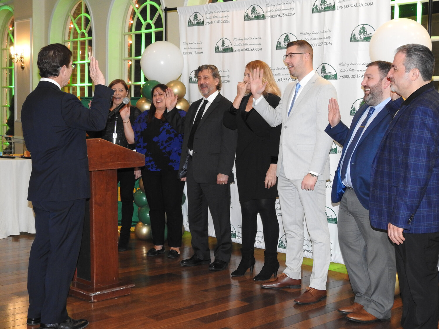 Lynbrook Mayor Alan Beach inducting new members into the Chamber of Commerce at the organization’s Gala at the Coral House in Baldwin on Jan. 18.