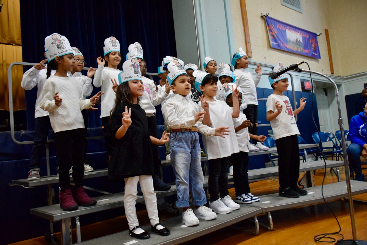 Alden Terrace School students sing songs such as ‘Lift Every Voice and Sing,’ ‘P-E-A-C-E for Dr. Martin Luther King Jr.,’ ‘Free at Last,’ ‘MLK’s Dream,’ and more during an assembly on Jan. 12.