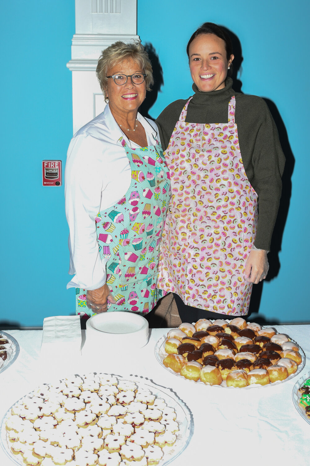 Lisa Acerno and Jessica Callaghan from Front Street Bakery, serving samples of sweet desserts.