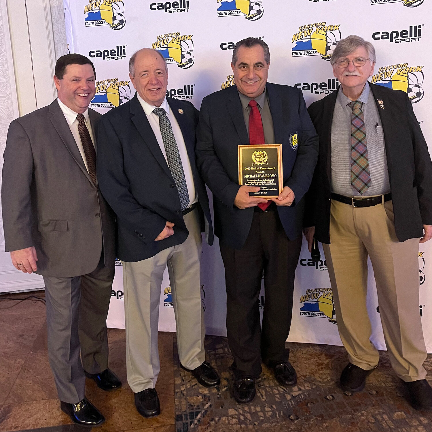 Eastern New York Youth Soccer Association first vice president Bill Smith with president Richard Christiano, Michael D’Ambrosio and Hall of Fame chairperson Ken Gulmi.