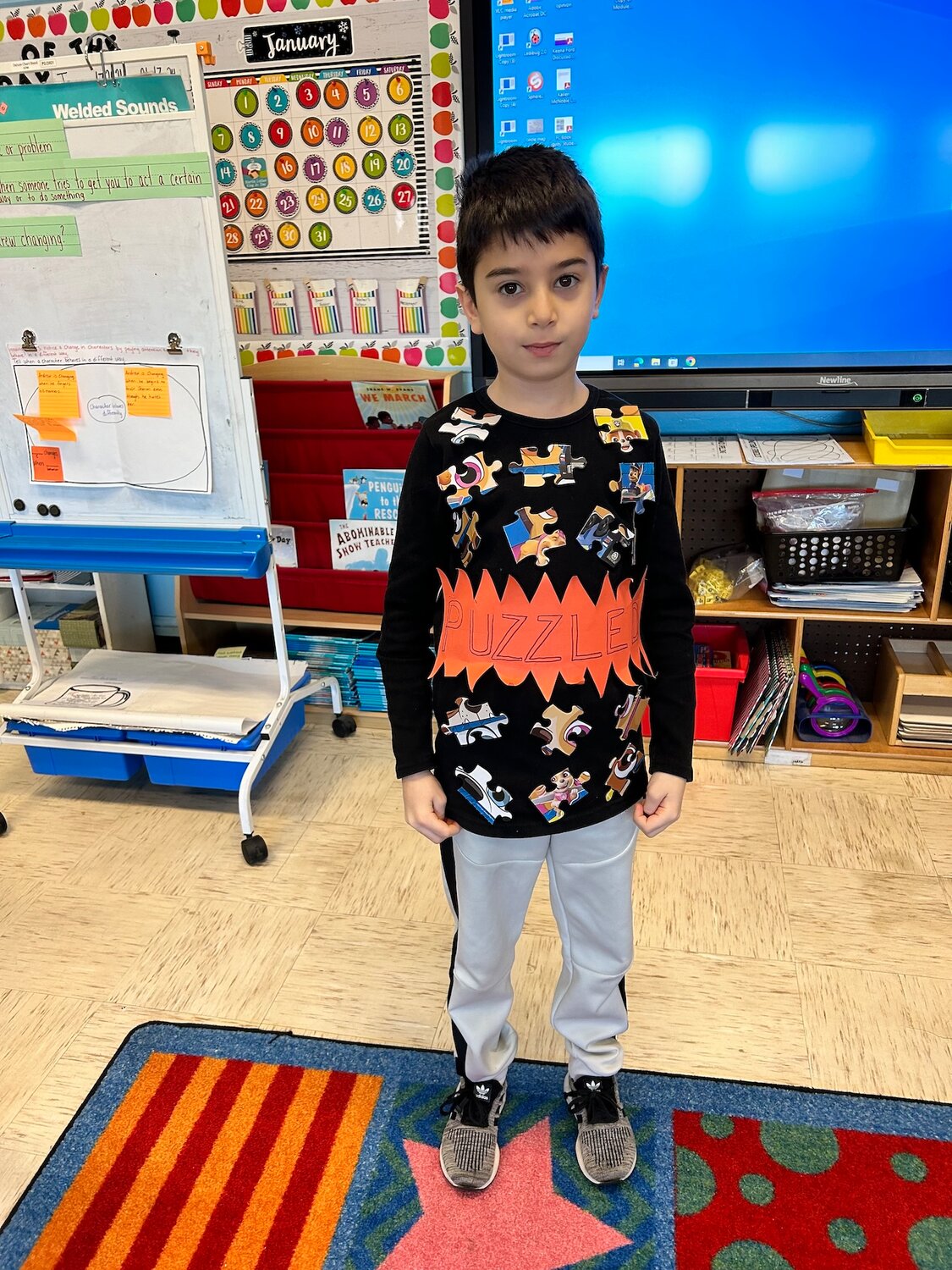 Centre Avenue School second grader Levant celebrating Dress Like a Word day by representing the word Puzzle.
