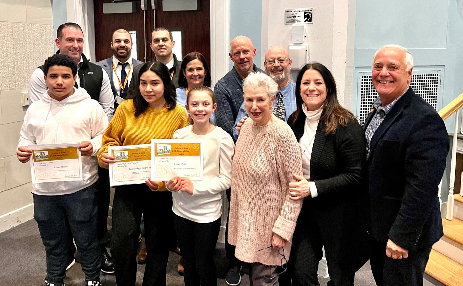 This year’s winners of the Andrew J. Stern Memorial Essay Contest Ethan Alvarez, Yeira Malaga, and Violet Roth being honored by members of the Stern family, Board of Education, and administration.