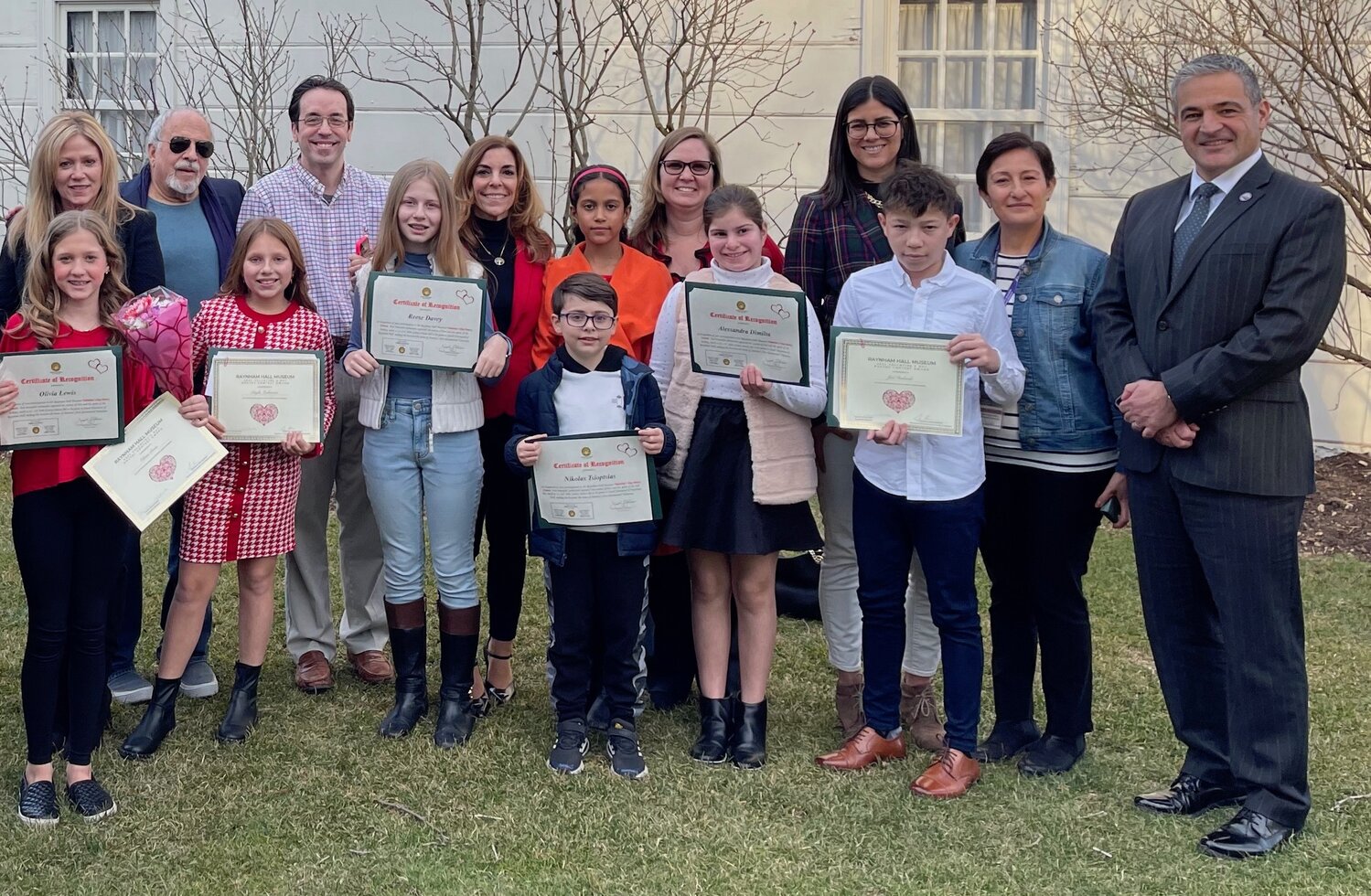 The winners of last year’s Raynham Hall Valentine’s Day Poetry Contest gathered outside the museum with elected officials, museum staff and educators and administrators from the Oyster Bay-East Norwich School District.
