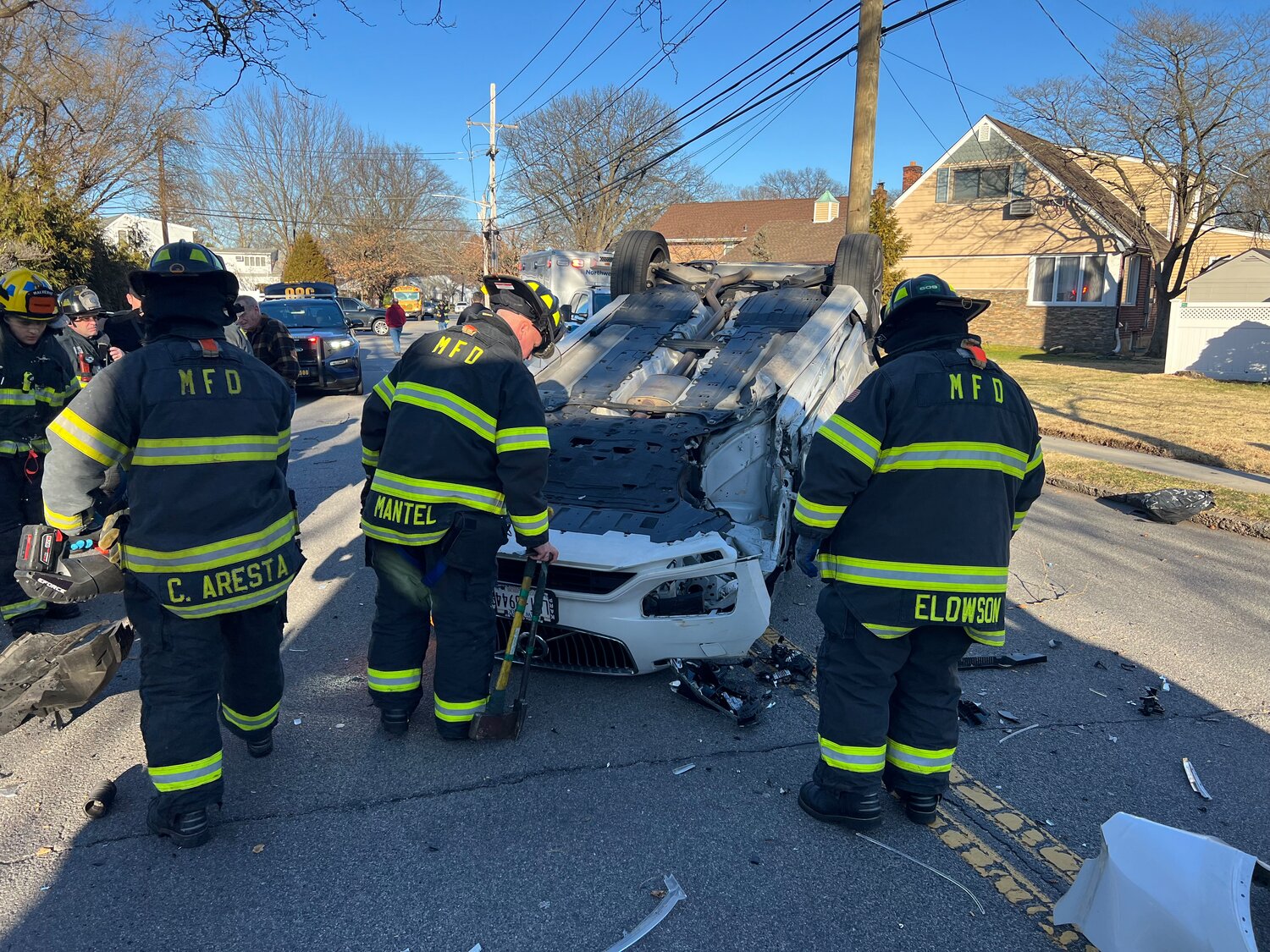Malverne firefighters helped to rescue a mother and two children from an overturned SUV on Cornwell Avenue in the village on Feb. 5.