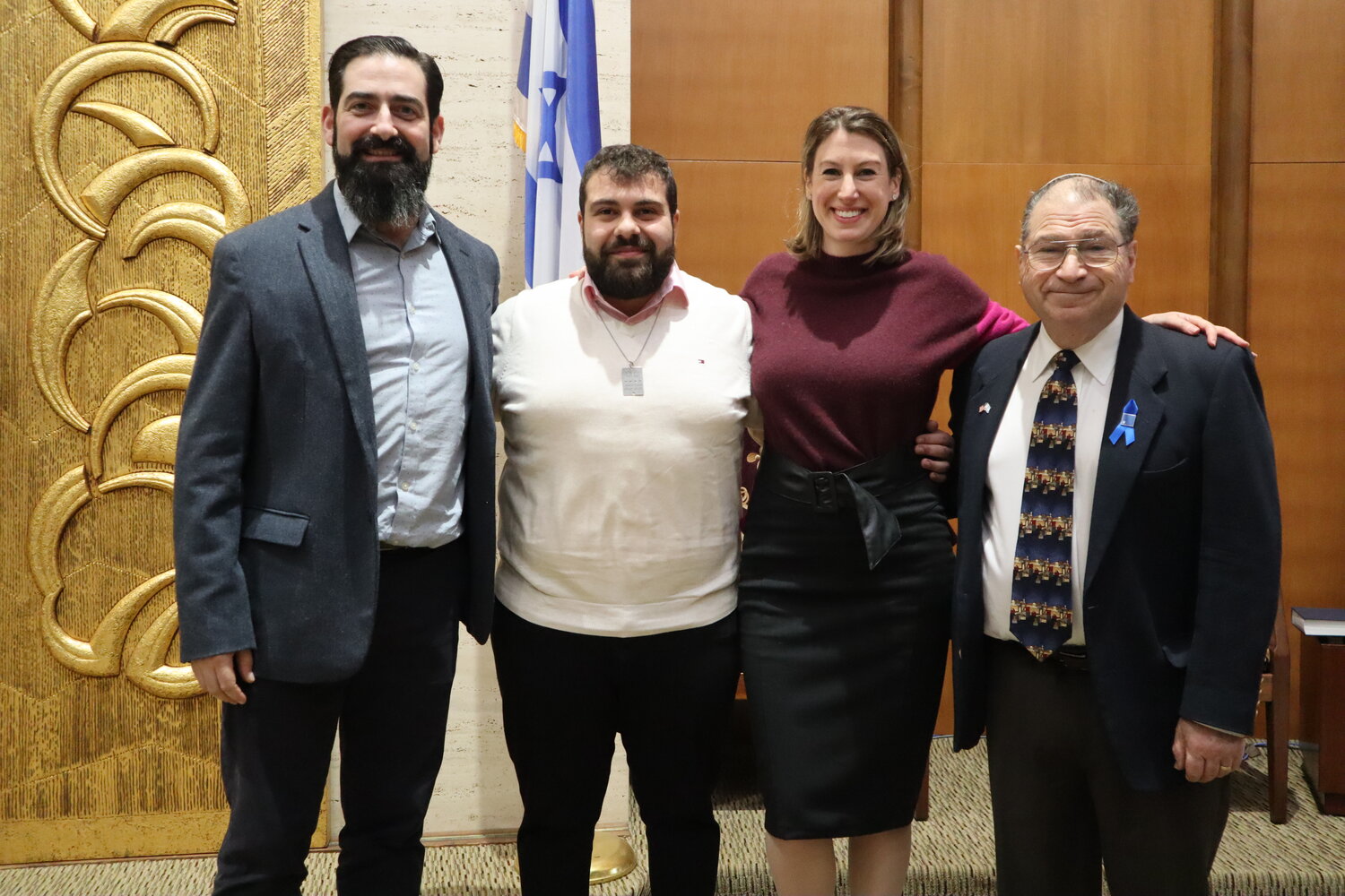 Rabbi David Lerner, left, invites Amit Yaacov, a human resources officer with the Israeli Defense Forces, to discuss his experiences in the Gaza Strip at Shabbat services last Friday night at Congregation B’nai Sholom-Beth David in Rockville Centre. They are joined by Cantor Alexandra Weiser and Board Chairman Ira Salwen.
