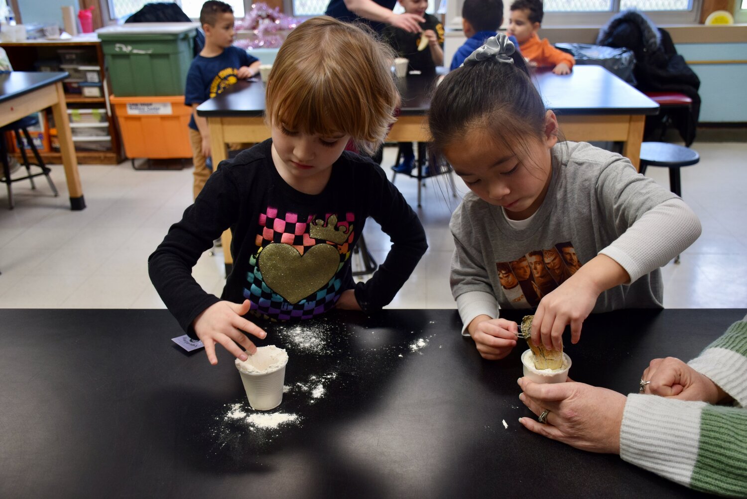 Students create dinosaur tooth replicas to take home at Franklin Square’s John Street School between Jan. 29 and Feb. 2.