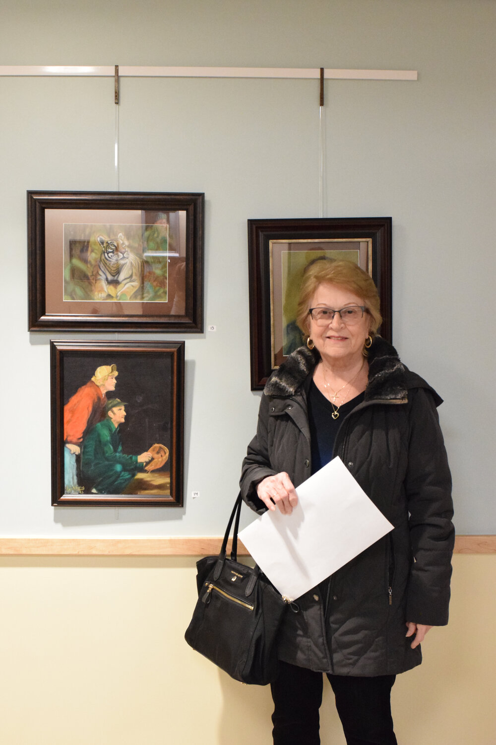 Barbara Reichling of Farmingdale in front of some of her pieces.