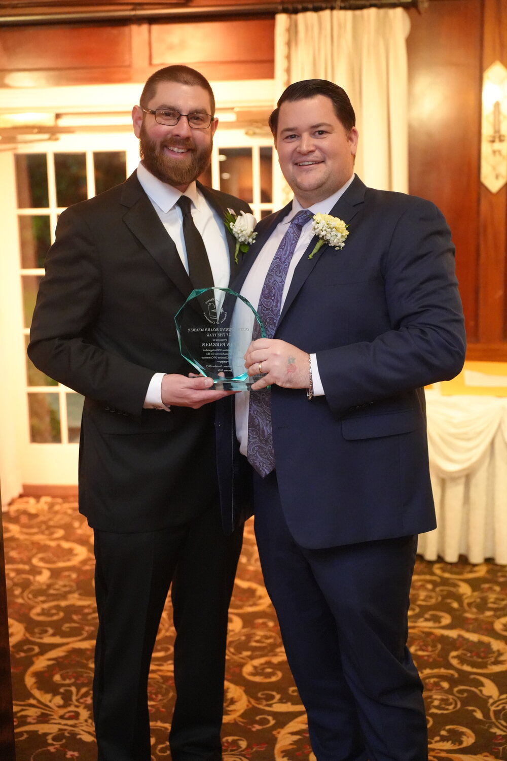 James Skinner, immediate past president of the chamber, with Ryan Parkman, who was named Board Member of the Year.