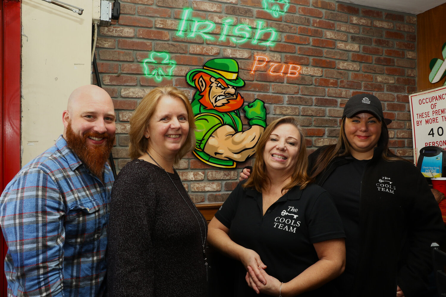 From left, Shawn Sabel, owner of the Irish Pub; Nassau County Legislator Debra Mule; Susan Cools, and Samantha Cools at the fifth annual Chili Cook-Off, which was hosted by the Cools’.