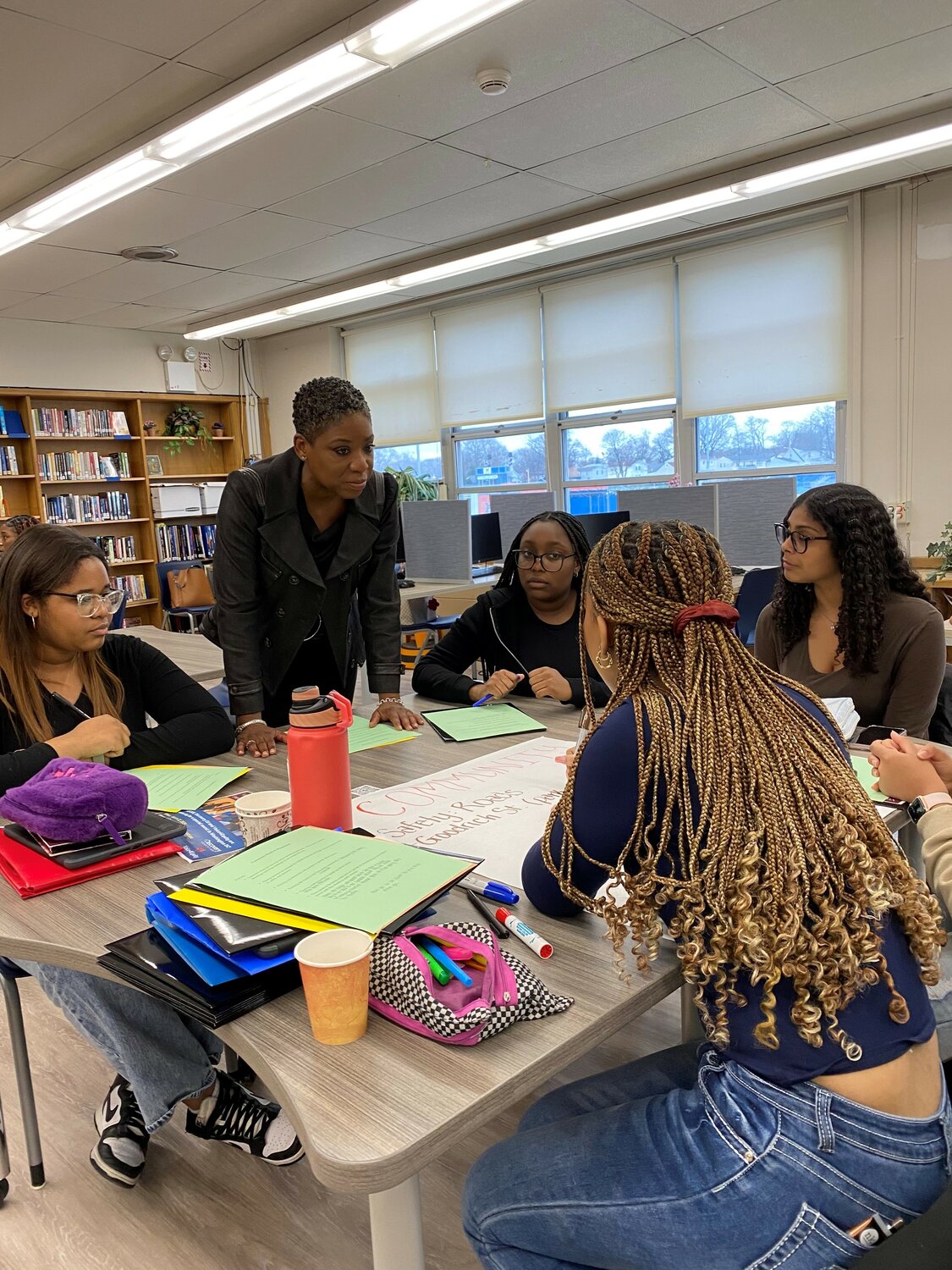 Nassau County Legislator, Siela Bynoe, helping students from both Uniondale and Malverne with their projects on creating policy that would improve their local communities.