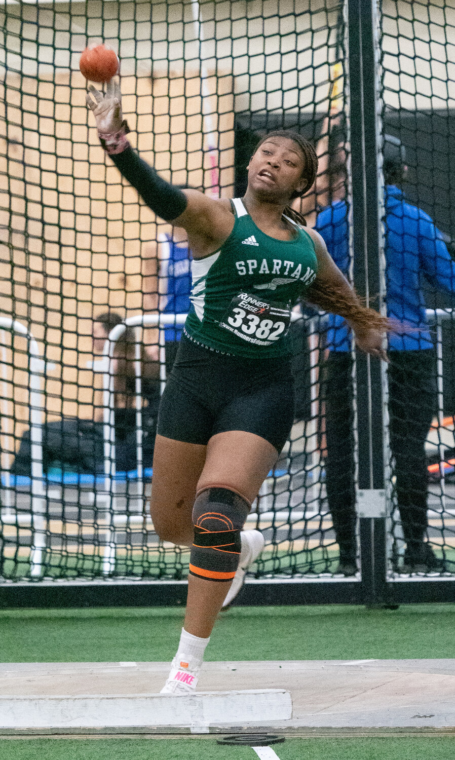 Moanna Thelusca cleared 34 feet to win the Nassau Class B shot put crown and helped lead the Spartans to a runner-up finish.