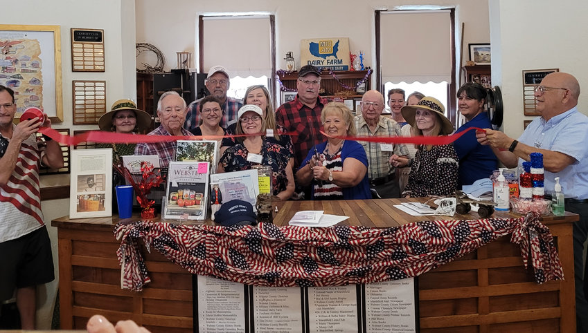 Here&rsquo;s to 25 more! History in the making as various members of the community gather for the 25th Anniversary of the Webster County Historical Museum ribbon cutting.