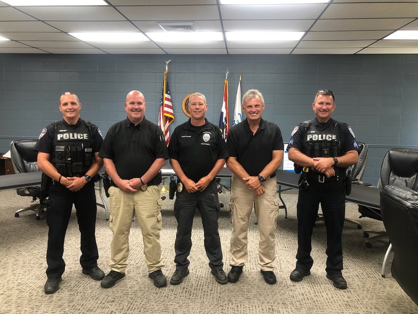 Marshfield&rsquo;s Finest stands together as they welcome a Rick Hamilton as their newest on-reserve detective. &ldquo;We are so lucky to have Hamilton, he has about 25 years experience. He is known for having a pretty hard work ethic and being thorough. We are very grateful, and all our guys are supportive,&rdquo; shares Marshfield Police Chief Doug Fannen. Pictured from left to right: Officer Josh Burris, Detective Joe Taylor, Chief Doug Fannen, Reserve Detective Rick Hamilton, and Sergeant Richard Neal.
