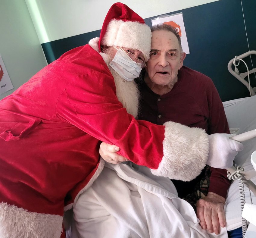 Webco Resident Don Letzig is one of many residents who received a visit from Mr. Christmas.   Mail Photo by John &quot;J.T.&quot; Jones