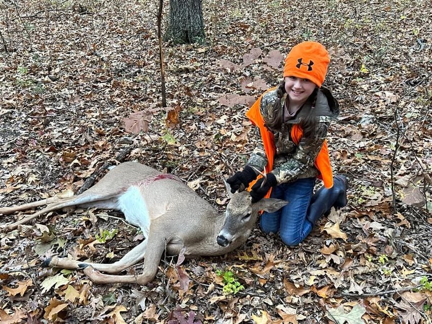 Lanie Rust, 9, of Marshfield. Pictured with her first deer; a 4 point.