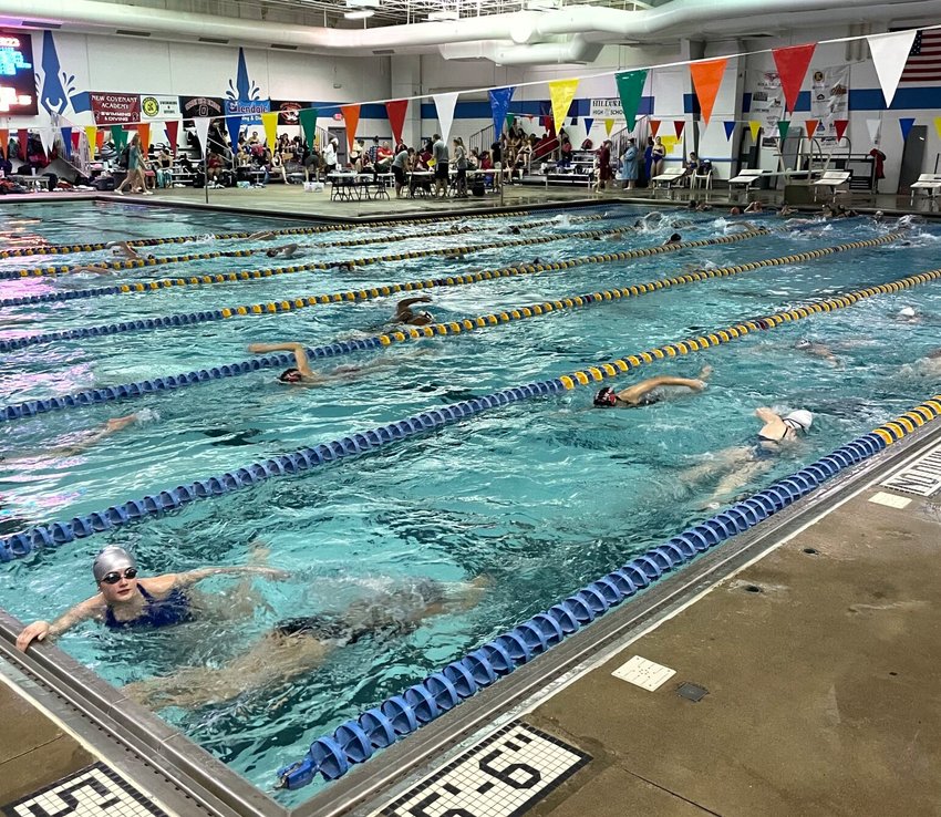 The swim teams warms up before the Ozark Invitational. The meet hosted 31 teams with several Lady Jay swimmers placing in the top 20 and several breaking their personal records for the season.