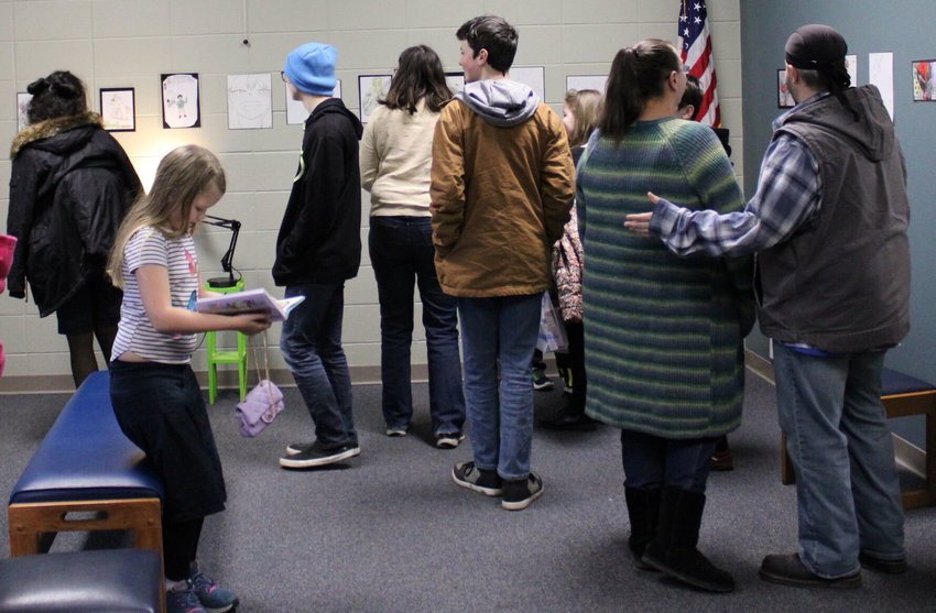 Pictured here are members and parents of the Tomodachi Club who gathered at the Webster County Library in Marshfield on Mar. 2 to check out each other's art pieces.   Mail Photos by John &quot;J.T.&quot; Jones