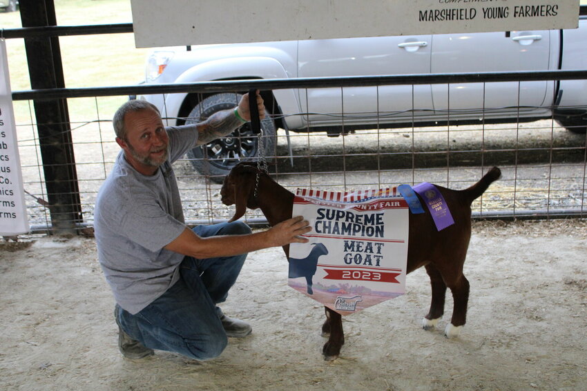Winning the Grand and Supreme championship with his Ewe is Tim Jenkins.   Mail Photos by J.T. Jones