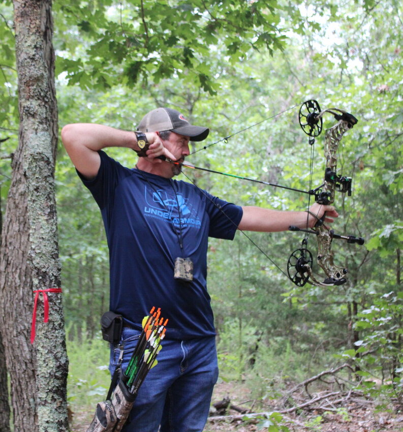 Sam Nelson readies his bow as he and many other bowhunters participated in the 17th Annual Outdoor Sportsman Event.   Mail Photo by J.T. Jones
